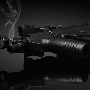 A smoking gun, symbolizing recent firing, emitting a cloud of smoke against a dark background.